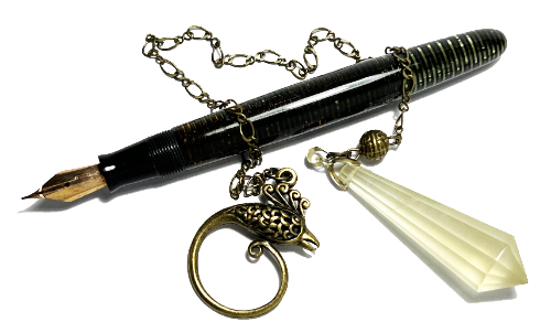 Vintage fountain pen and citrine pendulum